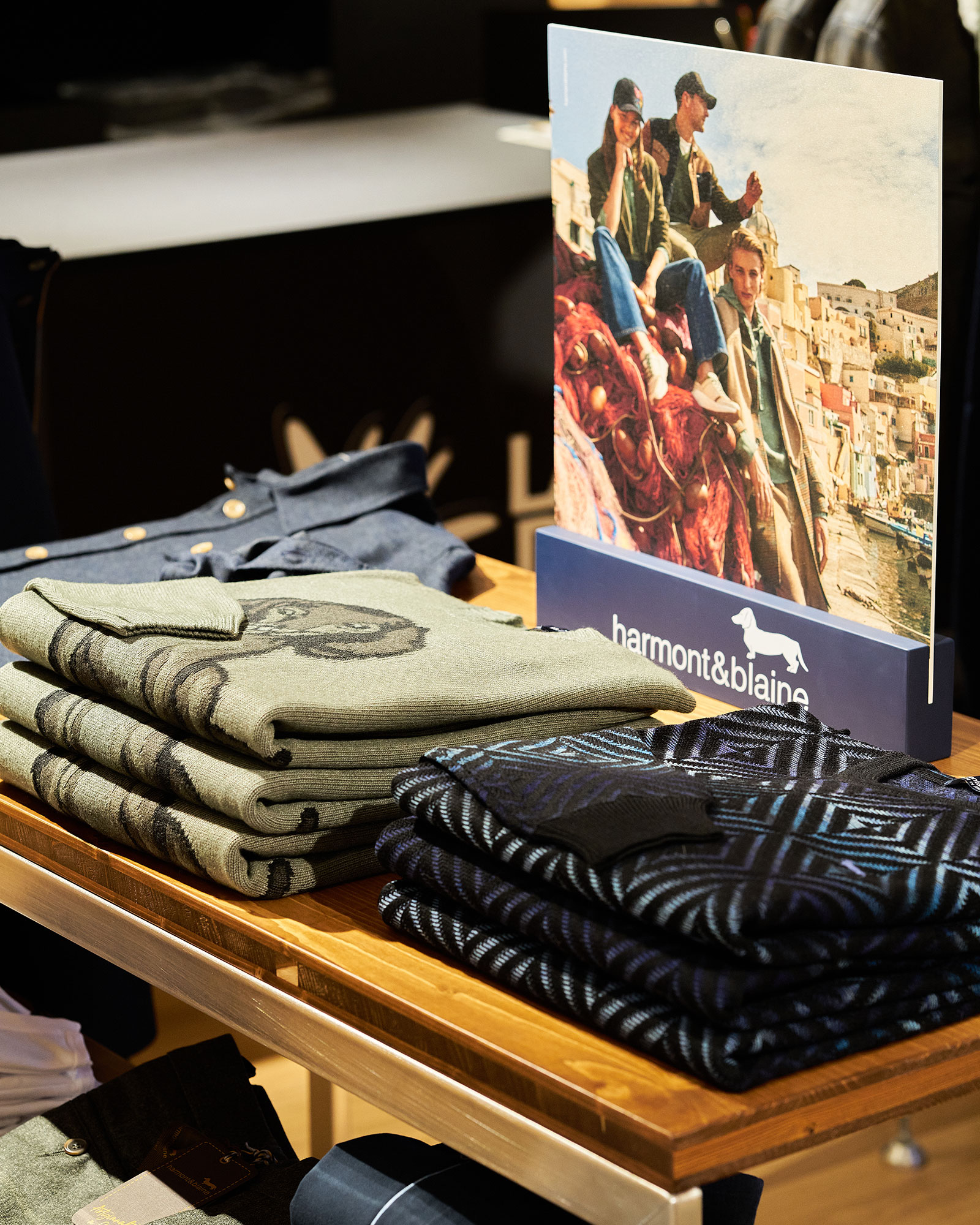 Folded sweaters and Harmont & Blaine display inside the new corner.