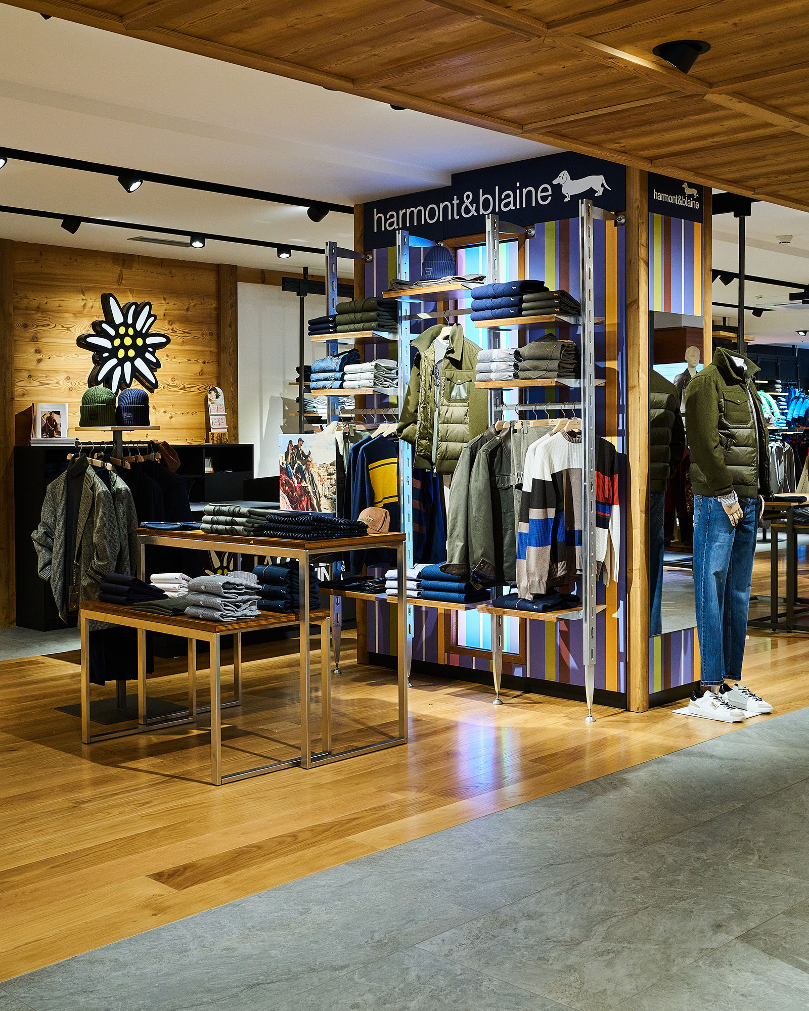 Set-up of the new Harmont & Blaine corner with wooden furnishings and signature stripes.